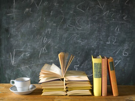 books, cup of coffee, blackboard, education, learning, science conceptの写真素材