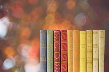 row of books on blurred nature background, free copy spaceの写真素材
