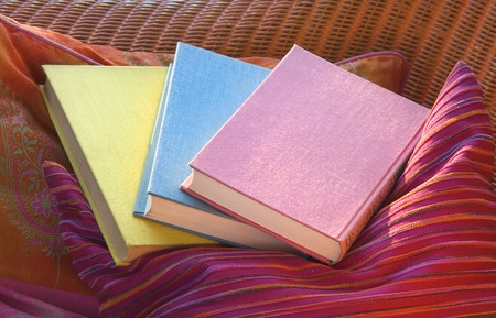 books on a pillow in the evening sunの写真素材