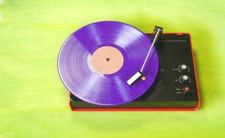 hipsters reto truntable with purple colored vinyl record, free copy spaceの写真素材