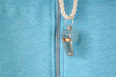 whistle of a soccer or football referee or trainer, free copy space