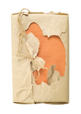 book with torn wrapping paper, isolated on white, free copy spaceの写真素材