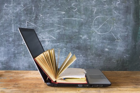 open book and laptop, learning, education, e-book conceptの写真素材