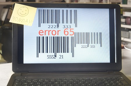 error message on a laptop with monday smile