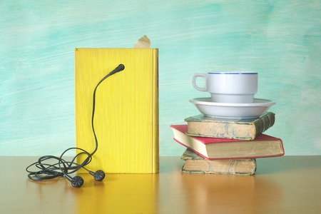 audio book and a cup of coffee, modern reading concept