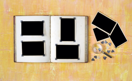 vintage photo album with empty photo frames, photo corners, free copy spaceの写真素材