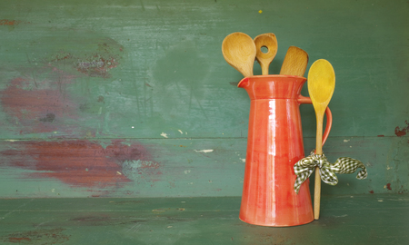 vintage kitchen utensils in an old jug, good copy spaceの写真素材