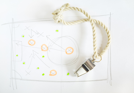 whistle of a soccer or football trainer or referee with scribble of tactical diagramの写真素材