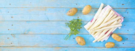 fresh asparagus, potatoes and parsley, flat lay , good copy cpaceの写真素材