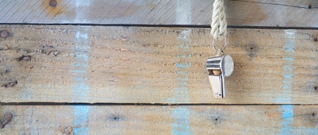 whistle of a soccer / football referee, grungy background, panorama,free copy space