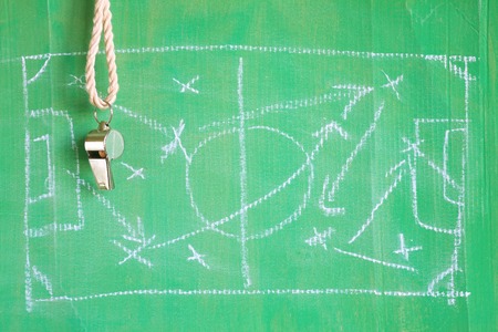 Whistle of a soccer or football referee / trainer with tactics scribbleの写真素材