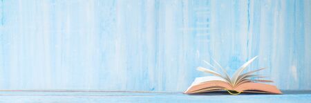 open book, close up on blue grungy background,reading, education, literature,learning, good copy spaceの写真素材