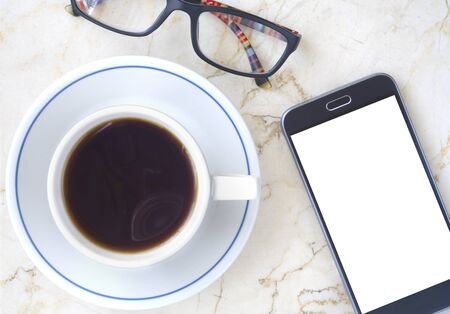 smartphone, cup of coffee and spectacles. Business,working,communication, social media mockupの写真素材