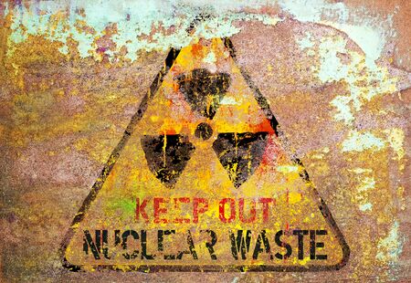 grungy nuclear atom waste warning sign, rotten and rusty, symbol for dangers of atomic energy