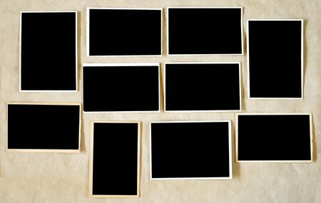 Set of vintage empty photographs,picture frames, flat lay on crumpled paper background, free space...