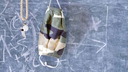 whistle of a soccer or football referee or trainer and corona maskの写真素材