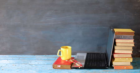 heap of books, cup of coffee and laptop, learning, education, home office, panoramic