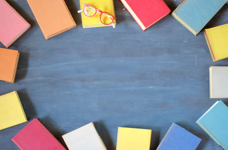 Flat lay of multicolored books. Reading, literature, education, library, home office mock up, large copy spaceの写真素材