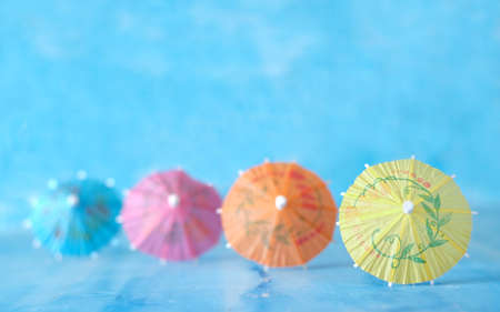 Multicolored Cocktail Umbrellas, spring and summer holidays symbol, selective focus, free copy spaceの写真素材
