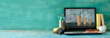 Global recovery and restarting business in 2021 after corona virus. Workspace,home office with...