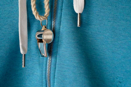 whistle of a soccer coach or referee on a green tracksuit jacket, great soccer event this year, free...