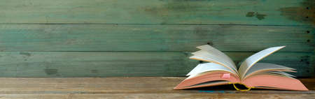 open vintage book on grungy background. Reading,literature,education,library,home office, back to...
