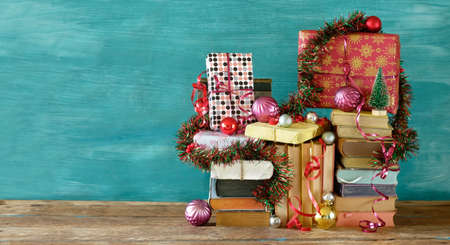 books as christmas gift, christmas present, reading, literature, education, making a gift concept, copy spaceの写真素材