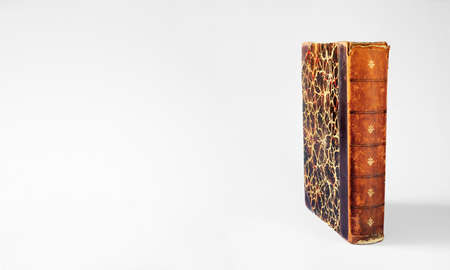 Vintage book on white background. Reading,literature,education,library,home office concept with large copy space.の写真素材