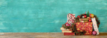 books as christmas gift,christmas present,reading,literature,education,making a gift concept, panoramic, large copy spaceの写真素材