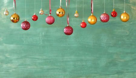 Hanging christmas balls and shabby chic painted background,christmas decoration mock up free copy spaceの写真素材