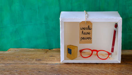 education, learning, back to school concept, words have power sign, book and shows