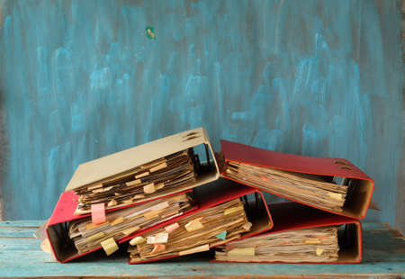 Heap of messy file folders, red tape, bureaucracy, aministration, business conceptの写真素材