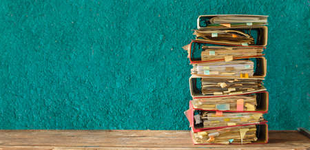stack of messy file folders,red tape, bureaucracy,aministration,business concept. Large free copy...