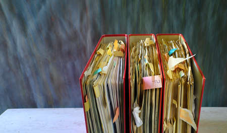 Row of messy file folders,red tape, bureaucracy,aministration,business concept. Free copy...