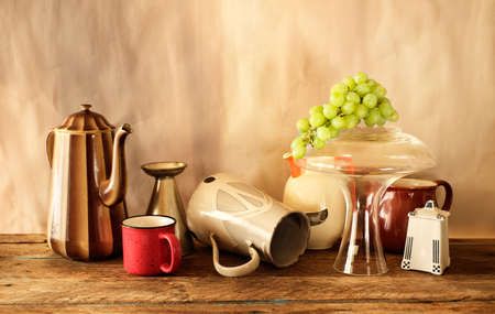 Vintage dinnerware, kitchen utensils and green grapes, free copy space