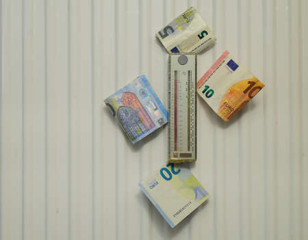 Radiator,meter and euro bills,rising heating costs and energy prices concepts,free copy space
