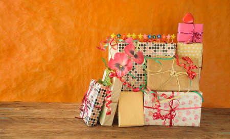 heap of birthday presents and caption happy birthday,personal gift and bunch of flowers,personal...