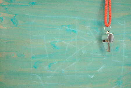 Whistle of soccer referee or trainer and soccer tactics scribble on green background. Great soccer event this year, large free copy spaceの写真素材