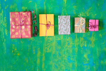 christmas gifts in a row, wrapped presents, merry christmas,making a present concept,free copy space