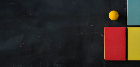 books and yellow ball, modern art inspired flat lay, education,reading,knowledge, home office concept.Panoramic, large copy space.の写真素材