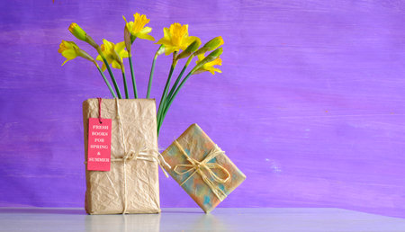 New book  releases for spring 2023, gift wrapped books, hang tag and flowers.Spring Book fair,...