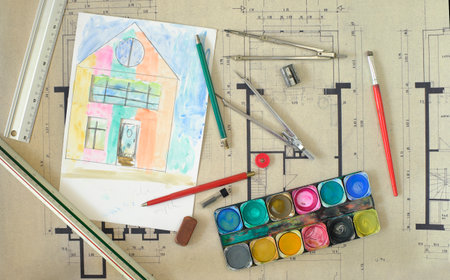 Construction and architecture concept. Residential building drawings and color scheme, flat lay, free copy space. Fictional drawing and painting.の写真素材