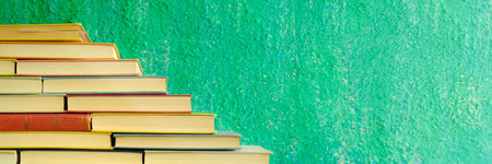 Stack of books forming a staircase, education, ladder of success, knowledge concept, panoramic,...