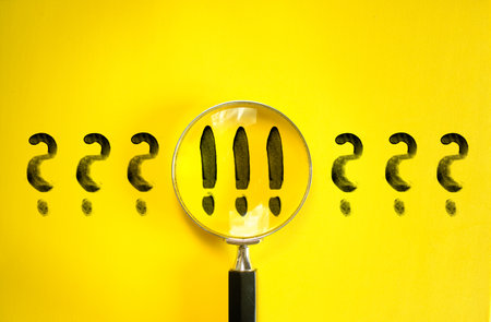 Magnifier enlarging the correct choice or check mark on yellow background. Business concept, idea, innovation, right choice, quality control and approval and contract assignmentの写真素材