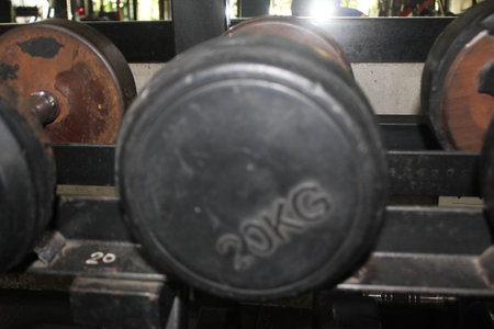 Dumbbells in a fitness center, closeup of photoの写真素材