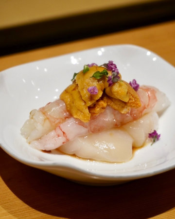 Japanese food, scallop on white plateの写真素材