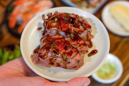 steamed pork with chili sauce in a white plate, selective focusの写真素材