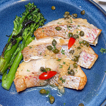 Grilled salmon fillet with capers, asparagus and capers