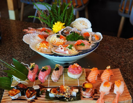 Japanese cuisine. Sushi and sashimi on wooden table.の写真素材