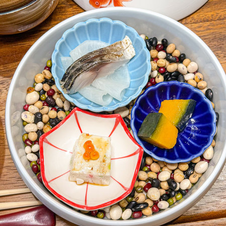 Sushi and sashimi in a bowl on a wooden tableの写真素材